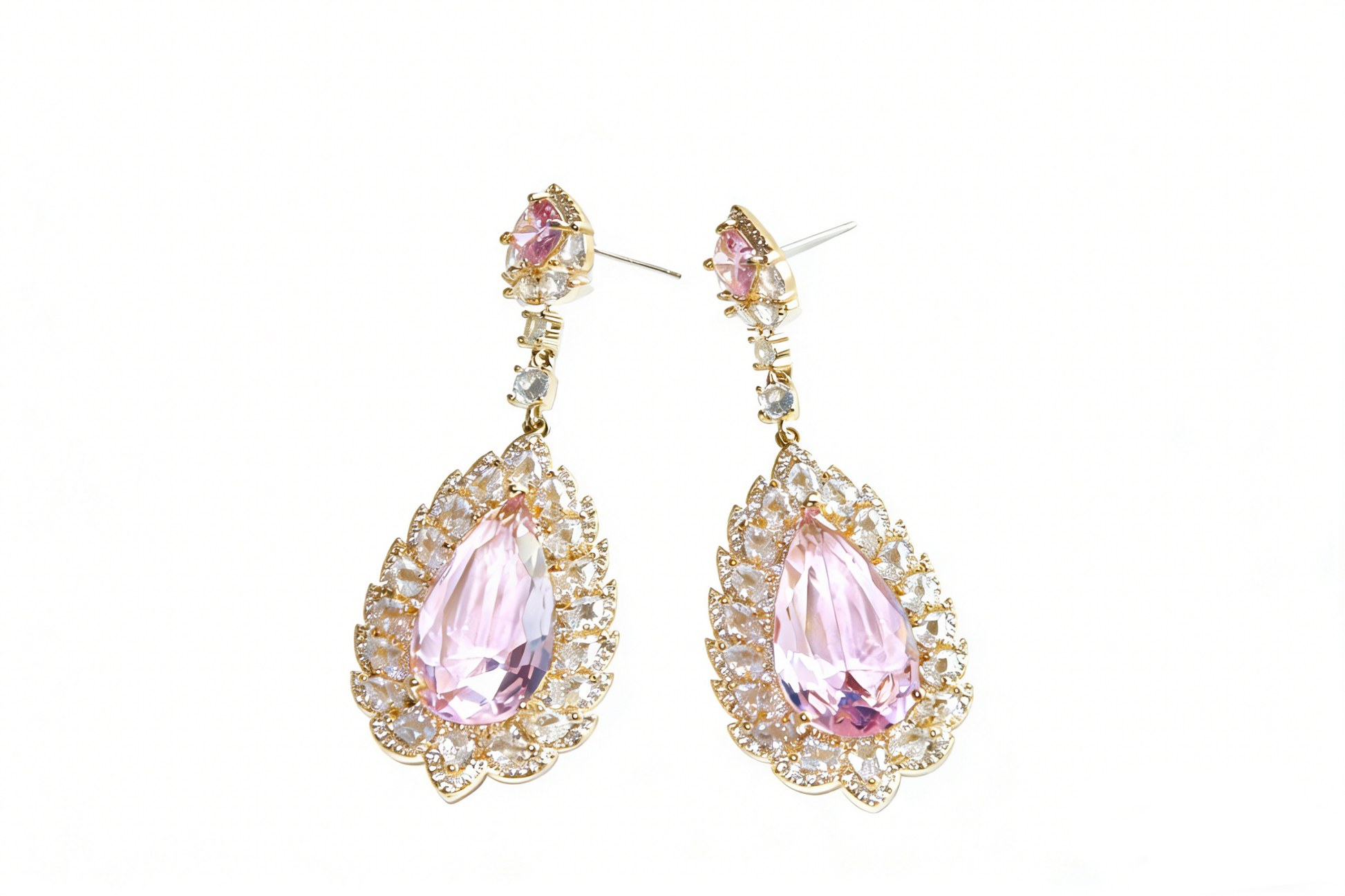 Close-up of pink teardrop halo earrings with vibrant pink center stone and clear crystal surround, sculptural modern heirloom jewelry for UK 2026 fashion trends.